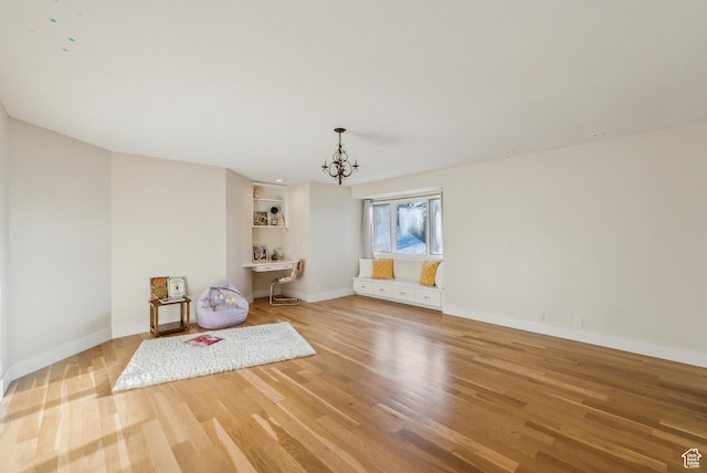 1919 E Baywood Dr, Holladay, UT 84117 - interior space with baseboards, light wood finished floors, and an inviting chandelier