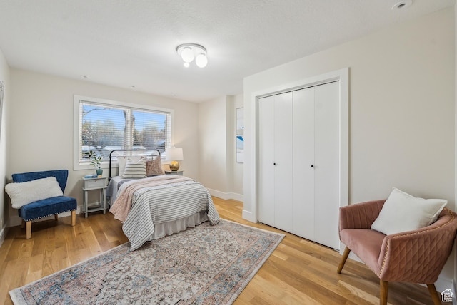1919 E Baywood Dr, Holladay, UT 84117 - bedroom with light wood-style flooring, a closet, and baseboards