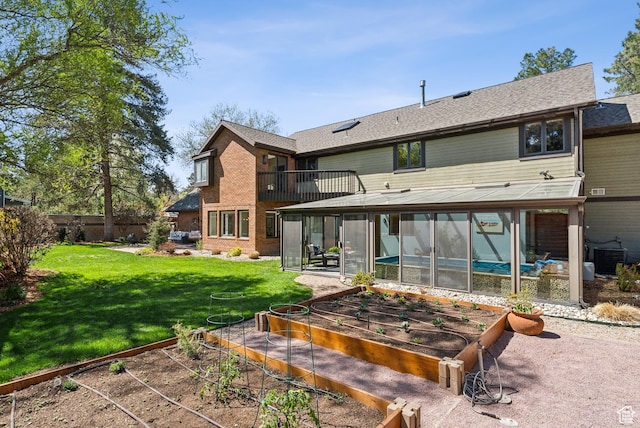 1919 E Baywood Dr, Holladay, UT 84117 - rear view of property with central AC unit, a sunroom, a yard, a vegetable garden, and brick siding