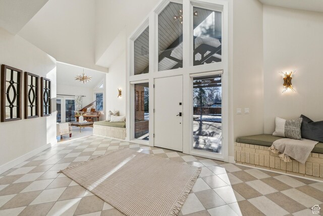 1919 E Baywood Dr, Holladay, UT 84117 - entryway featuring high vaulted ceiling, light tile patterned floors, and baseboards