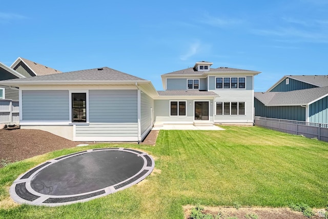 563 W Founders Blvd Unit 90, Saratoga Springs, UT 84045 - rear view of house with a trampoline, a patio area, and a shingled roof
