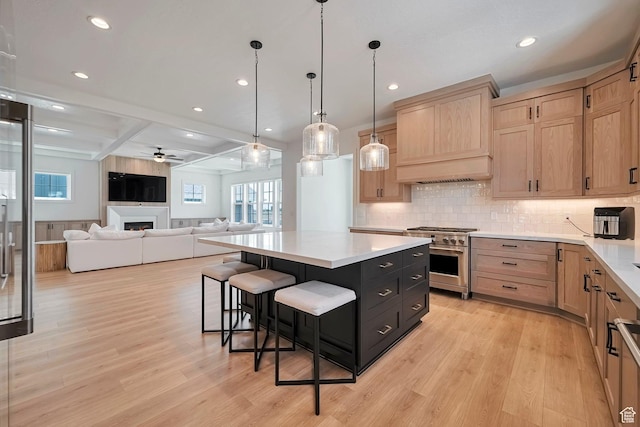 563 W Founders Blvd Unit 90, Saratoga Springs, UT 84045 - kitchen featuring high end stainless steel range, light brown cabinetry, a center island, light wood finished floors, and recessed lighting