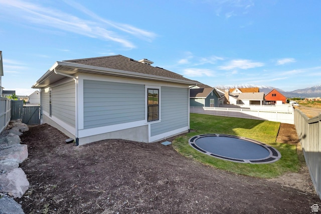 563 W Founders Blvd Unit 90, Saratoga Springs, UT 84045 - back of house with a trampoline, roof with shingles, and a mountain view