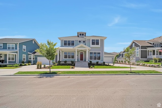 traditional style home with a garage, a residential view, and driveway