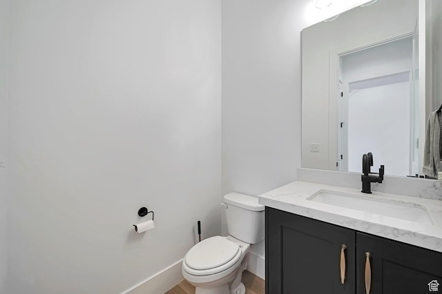 563 W Founders Blvd Unit 90, Saratoga Springs, UT 84045 - half bathroom with toilet, vanity, wood finished floors, and baseboards