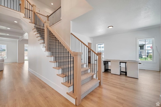 563 W Founders Blvd Unit 90, Saratoga Springs, UT 84045 - staircase featuring wood finished floors, plenty of natural light, baseboards, and recessed lighting