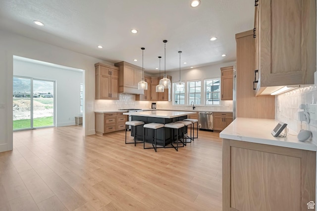 563 W Founders Blvd Unit 90, Saratoga Springs, UT 84045 - kitchen featuring dishwasher, a breakfast bar, a center island, healthy amount of natural light, and recessed lighting