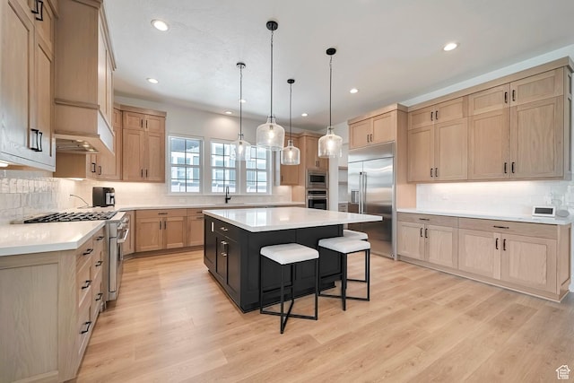 563 W Founders Blvd Unit 90, Saratoga Springs, UT 84045 - kitchen featuring built in appliances, light brown cabinetry, a kitchen bar, a kitchen island, and recessed lighting