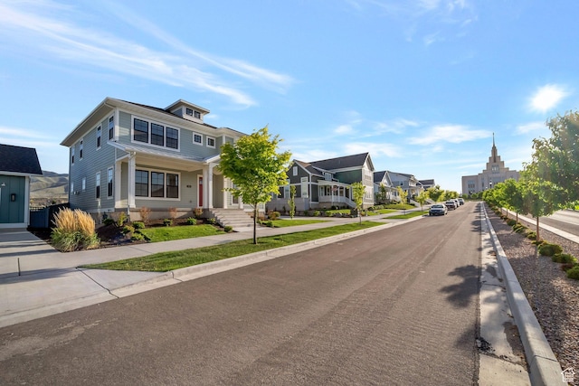 563 W Founders Blvd Unit 90, Saratoga Springs, UT 84045 - view of asphalt street featuring sidewalks, a residential view, and curbs