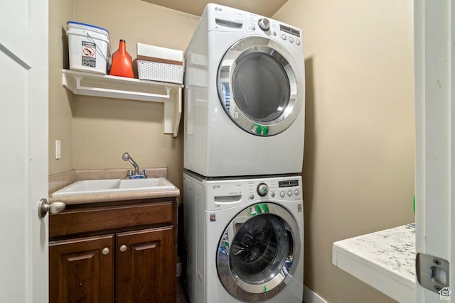 2043 W 1080 N, Provo, UT 84604 - laundry area featuring cabinet space, stacked washer and clothes dryer, and a sink