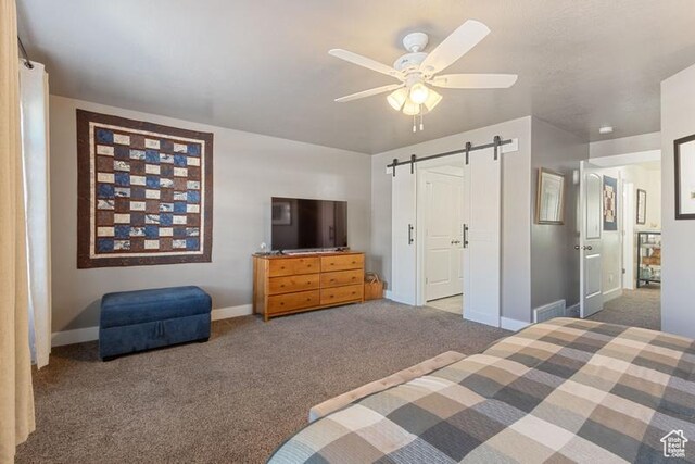 6225 S 1550 E, South Ogden, UT 84405 - bedroom with a barn door, carpet flooring, a ceiling fan, and baseboards