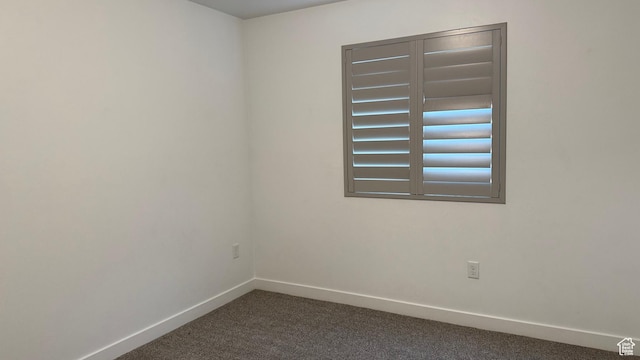 7886 S Fauna Ln W, West Jordan, UT 84081 - empty room featuring dark colored carpet and baseboards