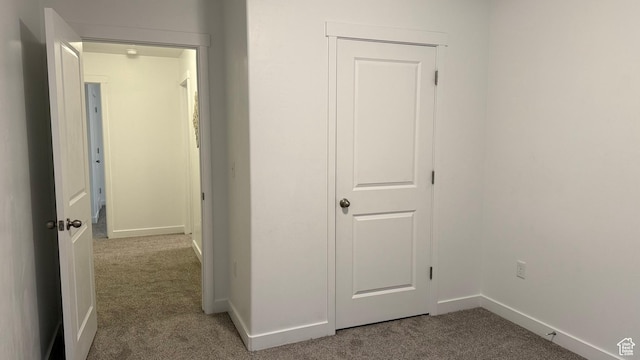 7886 S Fauna Ln W, West Jordan, UT 84081 - hallway with baseboards and carpet