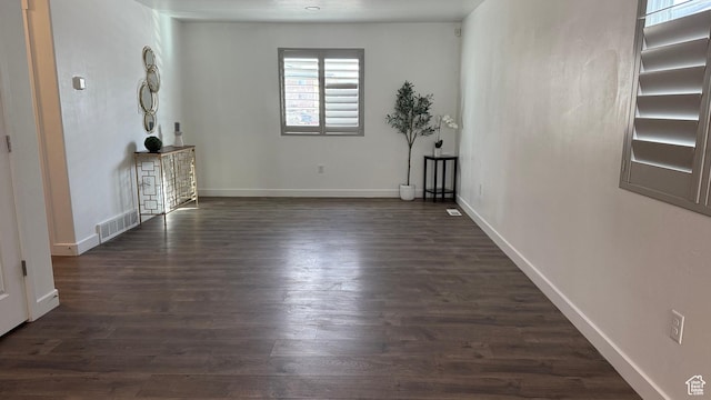 7886 S Fauna Ln W, West Jordan, UT 84081 - unfurnished room featuring visible vents, baseboards, and dark wood finished floors