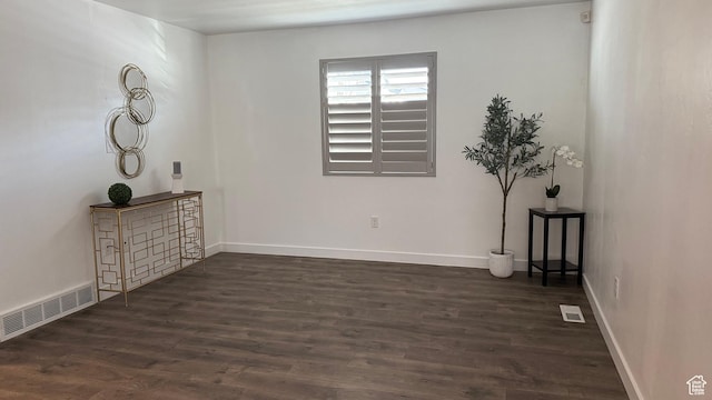 7886 S Fauna Ln W, West Jordan, UT 84081 - spare room featuring visible vents, baseboards, and dark wood-style floors