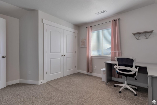 office with carpet flooring, baseboards, and visible vents