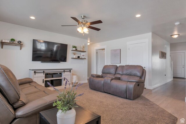 living area featuring recessed lighting, baseboards, ceiling fan, and wood finished floors