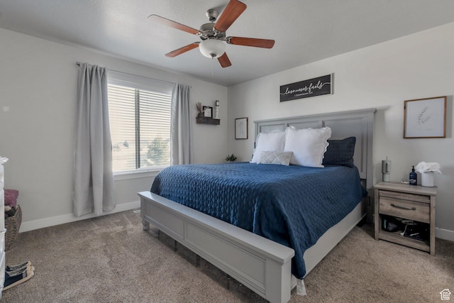 bedroom with carpet flooring, a ceiling fan, and baseboards