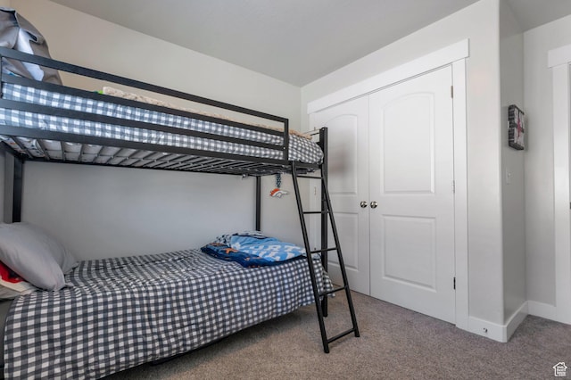 bedroom with a closet and carpet
