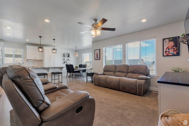 living room with recessed lighting, baseboards, and ceiling fan