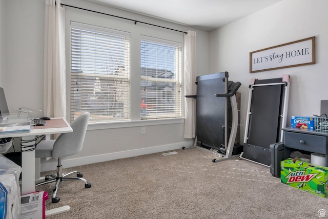 carpeted office space featuring baseboards