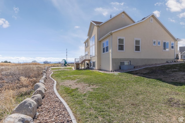 777 S Lake View Dr, Vineyard, UT 84059 - view of side of property featuring stairway, a lawn, and stucco siding