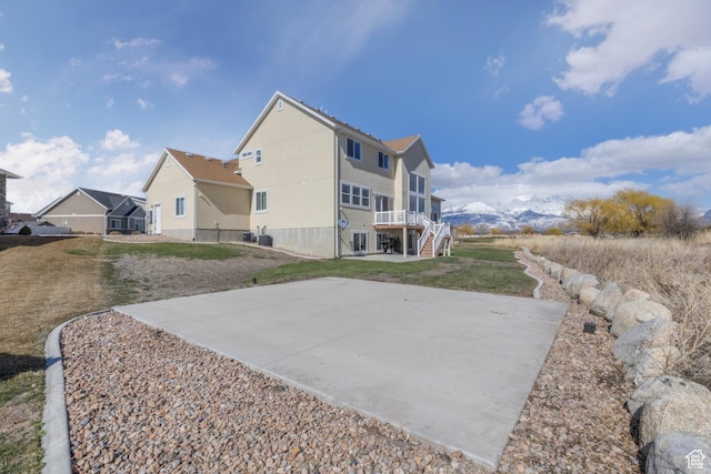 777 S Lake View Dr, Vineyard, UT 84059 - rear view of house featuring stairway, a residential view, and a yard