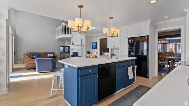 315 Stonehenge, Providence, UT 84332 - kitchen featuring a notable chandelier, black appliances, blue cabinetry, a sink, and light countertops