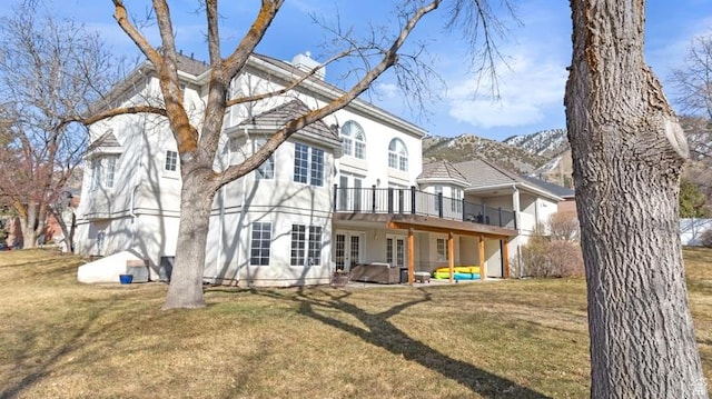 315 Stonehenge, Providence, UT 84332 - back of property with a wooden deck, a lawn, french doors, and stucco siding