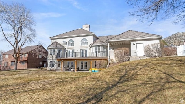 315 Stonehenge, Providence, UT 84332 - rear view of house with a lawn, french doors, a chimney, and stucco siding