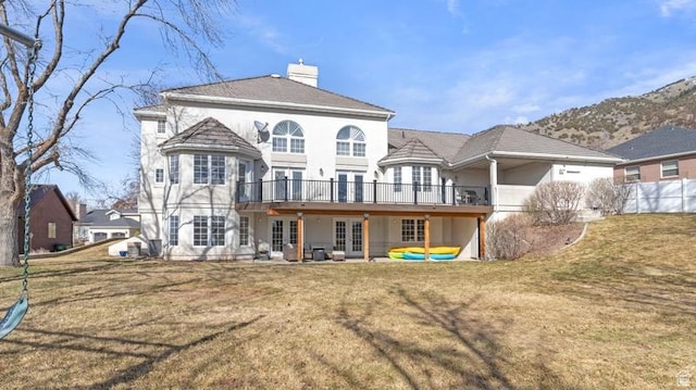 315 Stonehenge, Providence, UT 84332 - back of property with french doors, a lawn, a chimney, and stucco siding