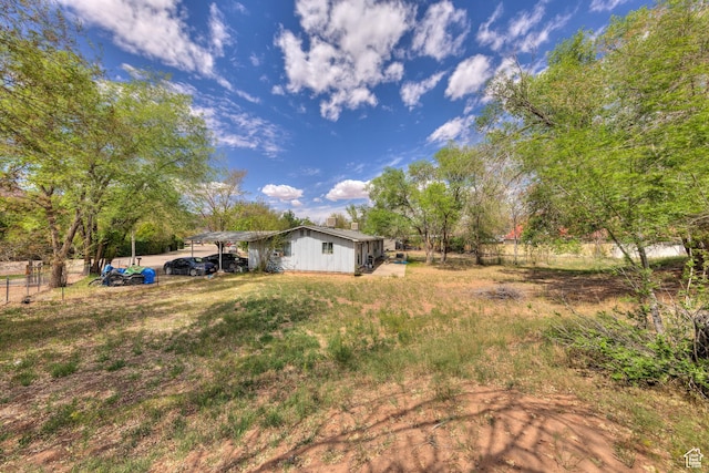 451 & Dr, Moab, UT 84532 - view of yard featuring fence and a carport