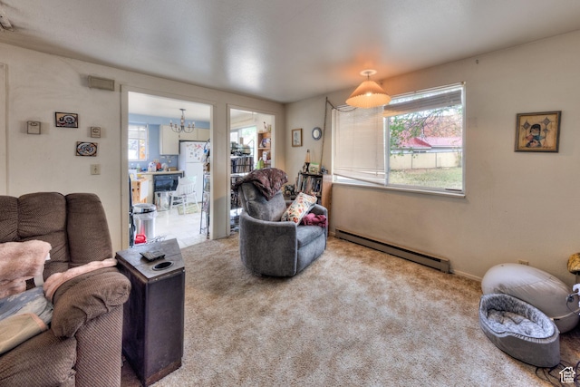 451 & Dr, Moab, UT 84532 - living room featuring plenty of natural light, a notable chandelier, a baseboard heating unit, and carpet flooring