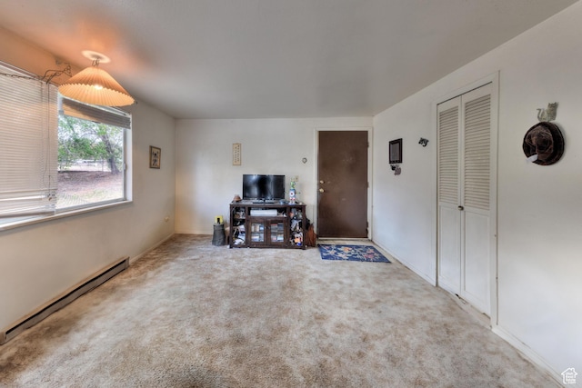 451 & Dr, Moab, UT 84532 - carpeted living room featuring baseboard heating and baseboards