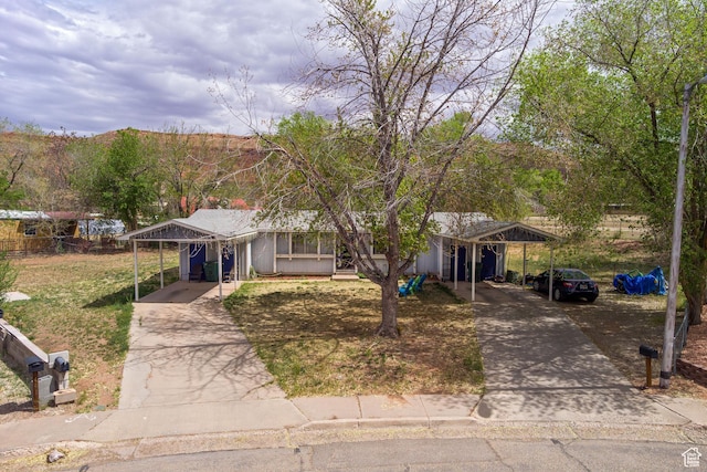 451 & Dr, Moab, UT 84532 - single story home with driveway and a carport