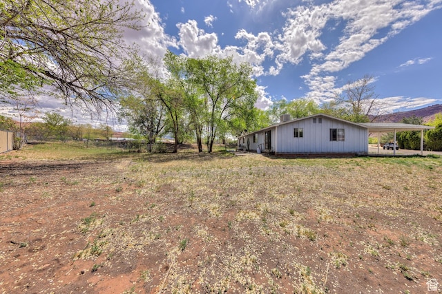 451 & Dr, Moab, UT 84532 - view of yard with fence and an attached carport