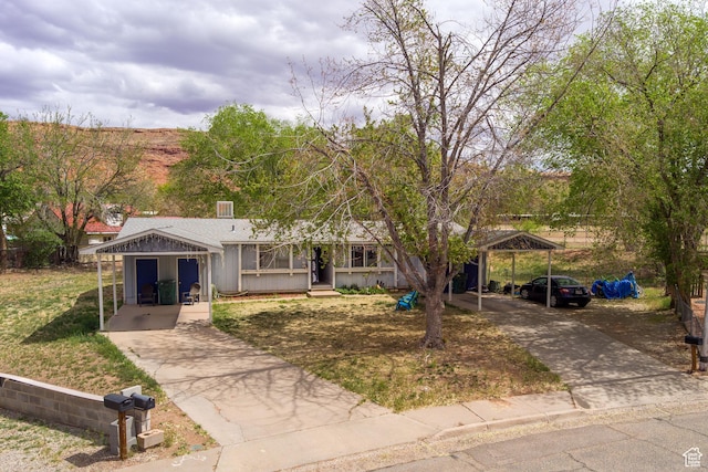 451 & Dr, Moab, UT 84532 - ranch-style home featuring driveway and a detached carport