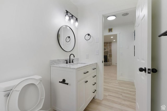 210 Ogden Cyn, Ogden, UT 84401 - bathroom with visible vents, wood finished floors, and vanity