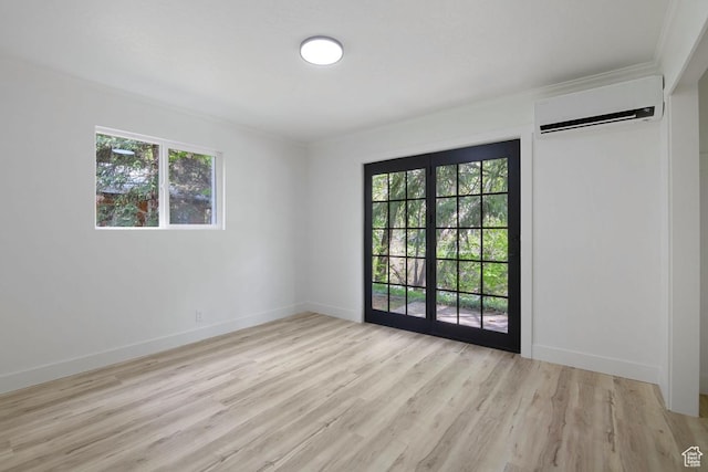 210 Ogden Cyn, Ogden, UT 84401 - unfurnished room with a wealth of natural light, light wood finished floors, a wall mounted air conditioner, and baseboards