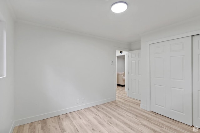 210 Ogden Cyn, Ogden, UT 84401 - unfurnished bedroom featuring light wood-style flooring, baseboards, a closet, and ornamental molding