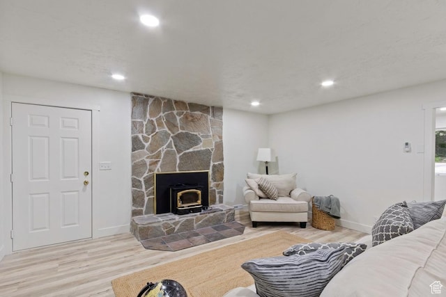 208 Ogden Cyn, Ogden, UT 84401 - living room with recessed lighting, a wood stove, baseboards, and wood finished floors