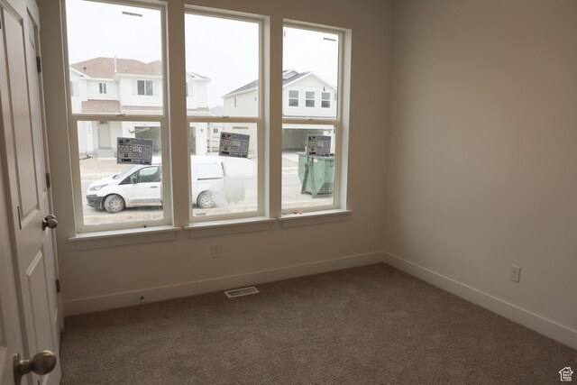 3719 N Janie St Unit 1014, Eagle Mountain, UT 84005 - carpeted empty room featuring visible vents and baseboards