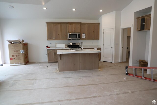 3719 N Janie St Unit 1014, Eagle Mountain, UT 84005 - kitchen featuring an island with sink, a sink, recessed lighting, stainless steel appliances, and light countertops