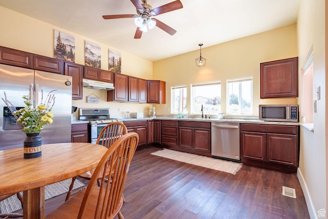 kitchen featuring under cabinet range hood, visible vents, stainless steel appliances, and light countertops