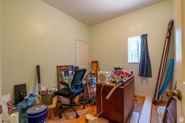 office area with wood finished floors and baseboards