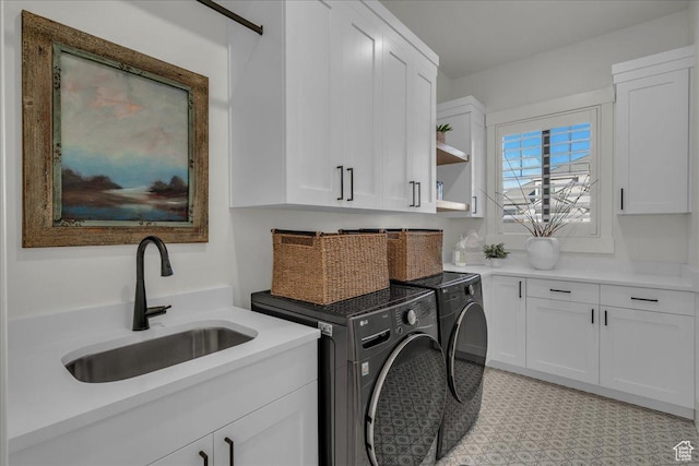 2904 E Stonedale Dr, St George, UT 84790 - laundry area with washing machine and clothes dryer, cabinet space, light floors, and a sink