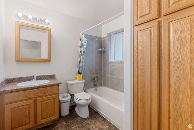 952 Canyon Rd, Logan, UT 84321 - bathroom with toilet, vanity, and shower / bath combo with shower curtain