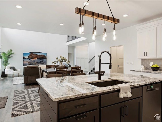 170 W 825 S, Willard, UT 84340 - kitchen with dark brown cabinetry, decorative backsplash, stainless steel dishwasher, white cabinets, and a sink