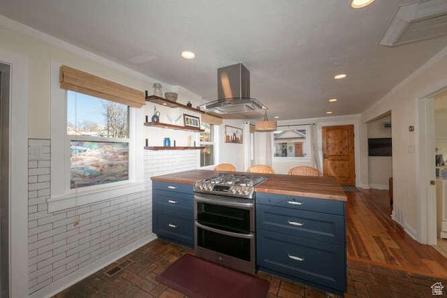 771 E Belmont Ave, Salt Lake City, UT 84105 - kitchen with blue cabinets, double oven range, recessed lighting, wall chimney range hood, and wooden counters