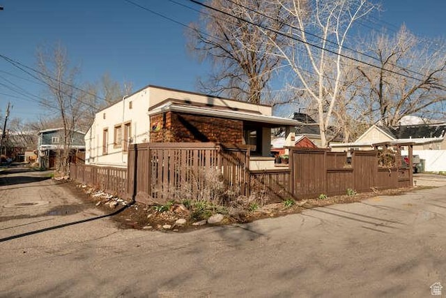 771 E Belmont Ave, Salt Lake City, UT 84105 - view of home's exterior with a fenced front yard and stucco siding